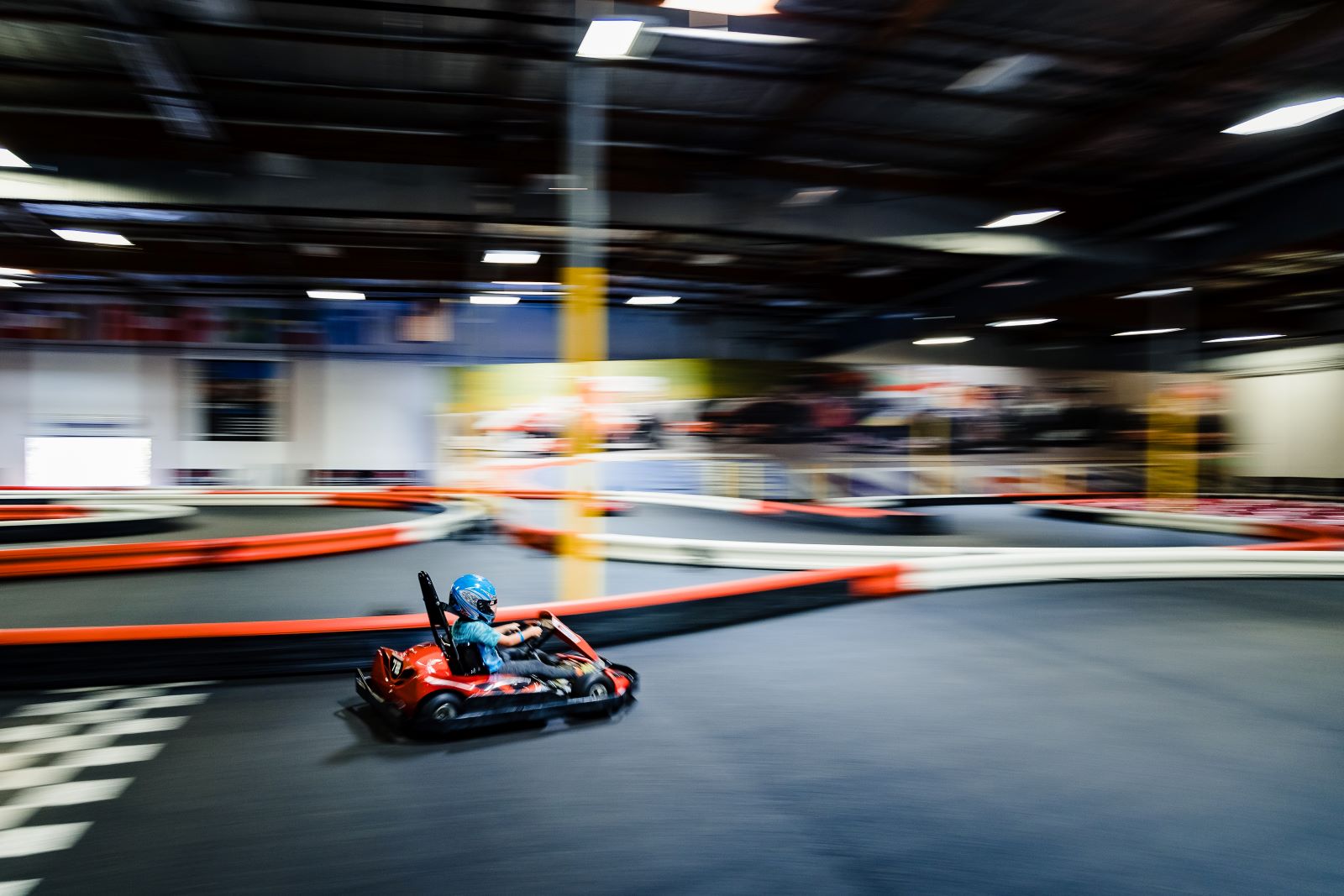 person racing on a go kart track